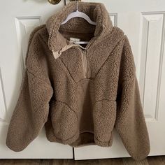 Half Zip Pull Over. Never Worn, No Stains Or Rips. Oversized And Super Soft. Beige Fleece Tops For Fall, Brown Fleece Sweater For Fall, Cozy Brown Sweatshirt For Fall, Cozy Brown Fleece Sweater, Cozy Beige Sweatshirt For Fall, Cozy Beige Tops For Cold Weather, Cozy Brown Top For Cold Weather, Cozy Beige Fleece Sweatshirt, Cream Fleece Sweater For Fall