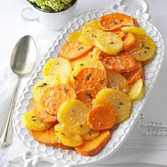 a white plate topped with sliced up carrots