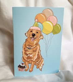 a brown dog wearing a birthday hat and holding some balloons with a cupcake on it