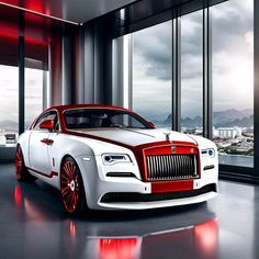 a white and red rolls royce parked in front of large windowed room with city view