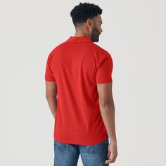 This item is FINAL SALE and is not eligible for exchanges or refunds. Features: Premium fitted short sleeve polo Three-button placket 60% combed ringspun cotton/40% polyester jersey Fabric will shrink minimally (5%) on a low heat setting in the dryer Classic side seam for the best look & fit Soft tag – tag is screen-printed on the polo for maximum comfort Fit: This is a contemporary/athletic cut. First model is 6'0" / 165 lbs and wearing size M Second Model is 6'1" / 250 lbs and wearing size XL Casual Red Polo Shirt With Collared Neckline, Red Fitted Short Sleeve Polo Shirt, Red Fitted Polo Shirt, Fitted Red Polo Shirt, Fitted Red Polo Shirt With Polo Collar, Classic Solid Polo Shirt, Classic Solid Color Polo Shirt, Classic Solid T-shirt With Button Closure, Red Fitted Polo Collar T-shirt