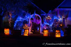 a house decorated with halloween decorations and lights