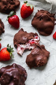 chocolate covered strawberries and cookies on a piece of paper