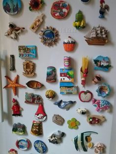 a refrigerator with many magnets on it