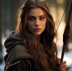 a beautiful young woman holding a bow and arrow