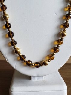 This is a vintage Napier, gold tone metal beads and glass beads necklace. There is a bit of the chain that doesn't have beads on it, as you can see in images. The beads can move on the necklace, slightly. This measures 25.25 inches across. Don't forget to stop in at my other Etsy shop... http://www.etsy.com/shop/xtdesigns. Follow me on Twitter at... MyYiayiaHadThat@MyYiayiaHadThat. If you have a wish list or are looking for something specific, please ask. I may have exactly what you are looking Vintage Gold Jewelry With Large Beads, Gold Metal Necklace With Large Beads, Gold Necklace With Large Metal Beads, Vintage Gold Jewelry With Polished Beads, Vintage Necklace With Polished Beads, Vintage Czech Glass Necklaces With Polished Beads, Vintage Czech Glass Necklace With Polished Beads, Vintage Czech Glass Polished Beads Necklace, Gold Metal Beaded Necklaces With Large Beads