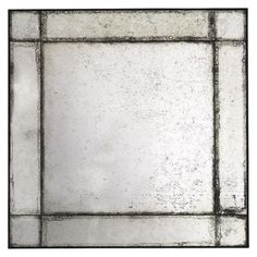 a square shaped mirror with black and white squares on the bottom, against a white background