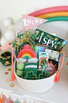 a basket filled with lots of st patrick's day items on top of a table