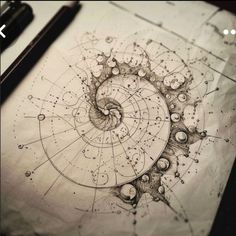 a spiral drawing on top of a piece of paper