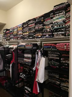 the closet is full of clothes and t - shirts