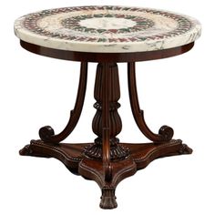 an ornately decorated table with marble top