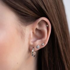 This decorative tiny stud is the perfect add on to your ear stack. Mix and match with our huggies for an on trend look. .925 Sterling Silver Cubic Zirconia Crystal Hypoallergenic post Height 6.2mm x Width 3.1mm Stone center: 2mm #E492 Beaded Studs, Classy Earrings, Ear Stack, Tiny Studs, Stacked Jewelry, Stud Set, Sterling Silver Studs, Sterling Silver Earrings Studs, Everyday Jewelry