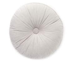 a white round cushion on a white background