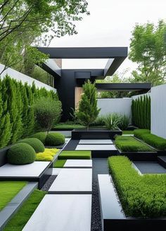 an outdoor garden with grass, bushes and trees