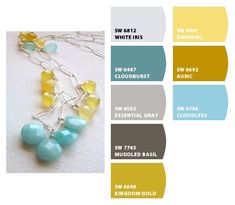 the color scheme for this necklace is blue, yellow and green with white beads on it