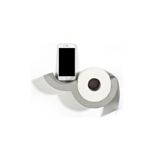 a cell phone is sitting on top of a roll of toilet paper