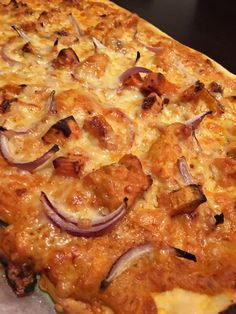 a pizza with onions and cheese on it