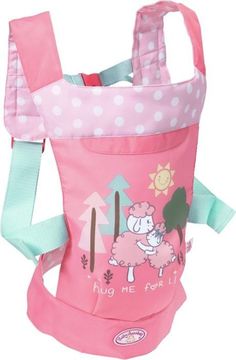 a pink baby carrier with polka dots and sheep on the front, it's attached to