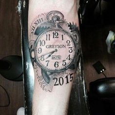 a man's arm with a clock tattoo on it