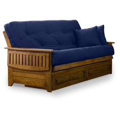 a wooden futon bed with blue sheets and pillows on it's back end