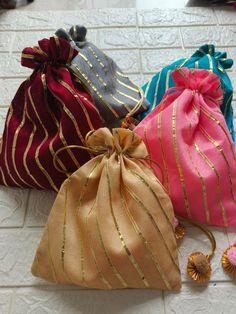 Product Item:Both Side Full Gota Potli Bags With Tassels Material: Brocade Fabric ,Gota Patti. Size:-7 x 5 Inches Approx Color- Assorted Color will be send ( Color can be customize) Details - Potli Bag: Exquisite potli bag adorned with golden touch, adding a touch of elegance and charm to any outfit. Wedding Favors: Perfect for weddings, Haldi , Mehndi these potli bags can be delightful favors for guests, offering a blend of tradition and style. The extravagant style of Gujarat comes to life thr Festive Red Bag For Gift Occasions, Festive Red Bags For Gifts, Red Festive Gift Bags, Festive Red Gift Bags, Festival Multicolor Pouch Bag, Multicolor Festival Pouch Bag, Celebration Multicolor Pouch Shoulder Bag, Red Shoulder Bag For Festive Gift, Festive Red Shoulder Bag As Gift