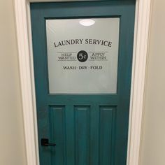 a green door with a sign that says laundry service and the number 54 wash - dry fold