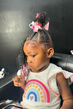 This cute crochet hairstyle combines detailed cornrows at the front that transition into lively, bouncy crochet curls on top, creating a stylish contrast of textures. The cornrows are decorated with adorable pink beads at the ends, adding a fun and colorful touch that's perfect for kids. Finally, the style is completed with - Click to see more of Fun and Creative Crochet Styles for Kids: 21 Ideas to Get Inspired! and follow us for more hairstyle ideas. // Photo Credit: Instagram @monacastyles_ Detailed Cornrows