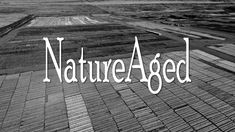 the words nature aged over an aerial view of farm fields in black - and - white