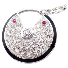 18k White Gold Diamond Ruby Large Amulette Pendant Necklace by Cartier. With 70 Round Brilliant Cut Diamonds VVS1clarity, E color total weight approximately 1.40ct 2 rubies total weight approximately .15ct This necklace is in mint condition and comes with a Cartier box. Details: Chain: Length: 23.5" Width: 2mm Pendant: 25.5mm Weight: 31.5 grams Stamped Hallmarks: Cartier 750 AUVXXX(serial number omitted) French Hallmarks *Free Shipping within the United States* Your Price: $25,000 T3299mtddd Cartier Amulette, Sterling Silver Cz Rings, King Edward Vii, Large Pendant Necklace, Love Bracelets, Fine Jewellery Necklace, White Gold Diamonds, Luxury Jewelry, Gold Pendant