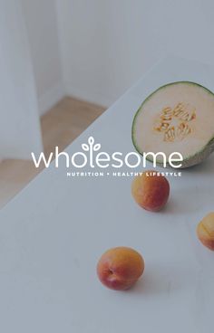 some fruit is sitting on a table with the words wholesome written in front of it