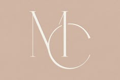 the letter m is shown in white on a beige background