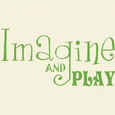 the words imagine and play written in green ink