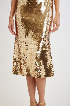 Shine on in Elie's Strapless Midi Dress in modern Ombre Gold Sequins. Perfect for special occasions and weddings, this eye-catching dress ensures you stand out with its captivating patina of metallic sequins in a graduated design with smaller sequins through the body ending in a larger playful sequin at the hem.     Limited Edition 50th Anniversary Collection    Elie Tahari Exclusive    Strapless Ombre Gold Sequin Midi Dress    50% Nylon, 50% Polyester    Runs true to Size    Length From Shoulde Sequin Midi Dress, Strapless Midi Dress, Long Sleeve Short Dress, Elie Tahari, Gold Sequins, Gold Sequin, Shine On, Knit Tees, Denim Coat