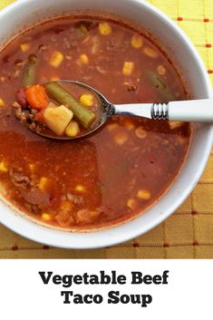 a bowl of vegetable beef taco soup with a spoon