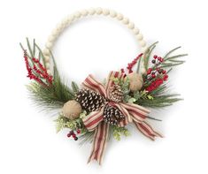 a christmas wreath with pine cones, berries and greenery on a beaded necklace