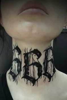 a woman with black ink on her neck