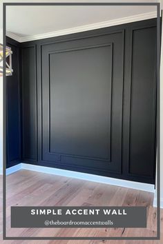 an empty room with black walls and wood flooring, the words simple accent wall above it