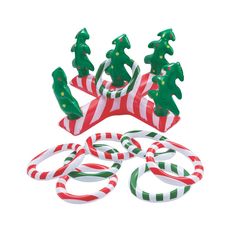 an assortment of candy canes and decorations on a white background, including christmas trees