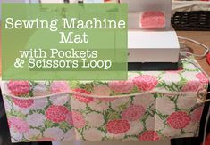 the sewing machine mat with pockets and scissors loop is sitting on top of a table