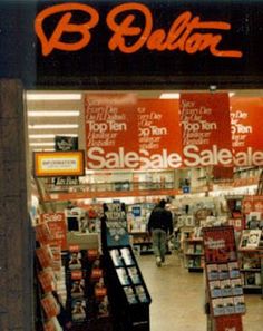 an image of a store front with the sale sign on it's display window