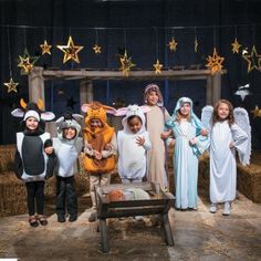 a group of children dressed up in nativity costumes