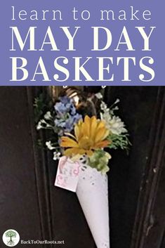 a white cone with flowers on it and the words learn to make may day baskets