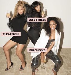 three women in black outfits posing for the camera and holding wine glasses with their names on them