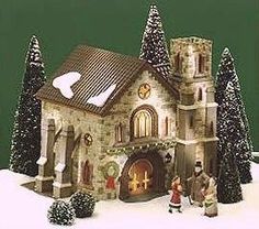 a christmas scene with a church and trees