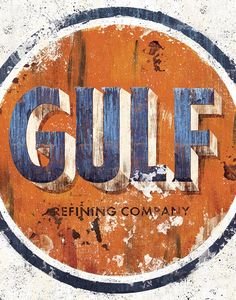 an old rusted sign with the word gulf painted on it's center circle