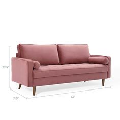 a pink couch sitting on top of a white floor