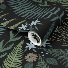 a black wallpaper with green leaves and flowers