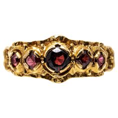 14k yellow gold ring. This ornate ring is a band style set with graduated, round-faceted, medium to dark color garnets, approximately 0.38 TCW, decorated with an ornamented pierced frame. Marks: 14k Dimensions: 9/16" across the top x 9/32" wide Weight: 1.5 gross dwt ring size: 6 Ornate Ring, Graduation Rings, Antique Wedding Rings, Jewelry Lookbook, Nature Inspired Jewelry, Dark Color, Yellow Gold Ring, Dream Jewelry, Pretty Jewellery