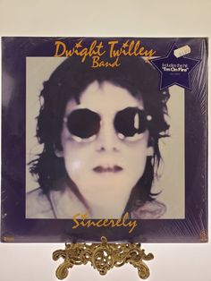 an album cover with the image of a woman's face and sunglasses on it