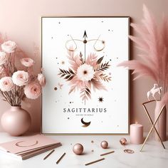 pink flowers and candles are on the table next to a white poster with sagittarius written in it